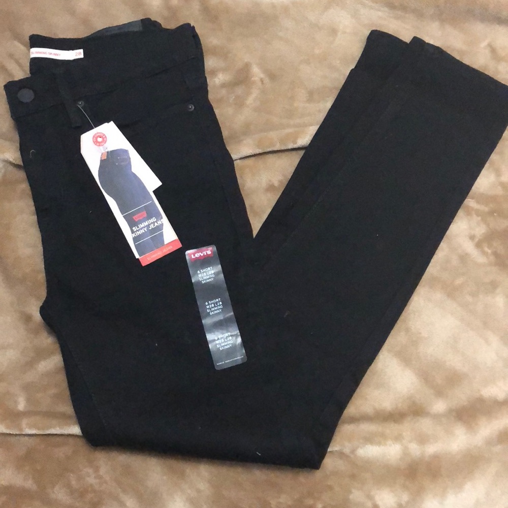 Levi “Slimming Skinny” black denim jeans; 28 short